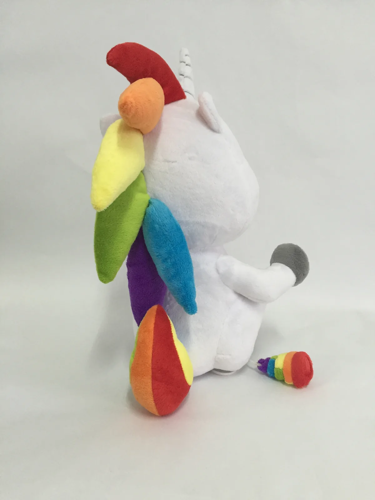 The same sample from behind, showing the mane running down the spine in six colours and the rainbow tail